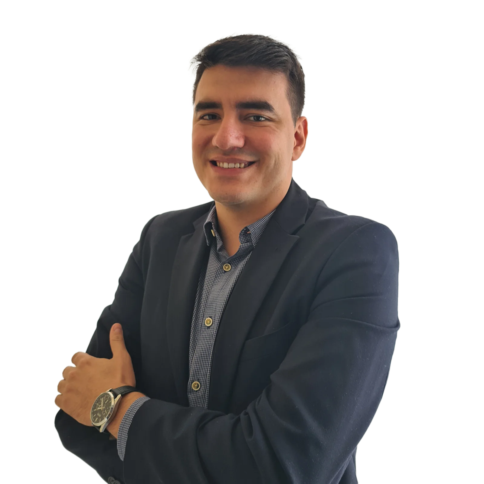 Portrait of Andre Mattos Junior wearing a dark blazer, patterned shirt, and a watch, smiling with arms crossed.