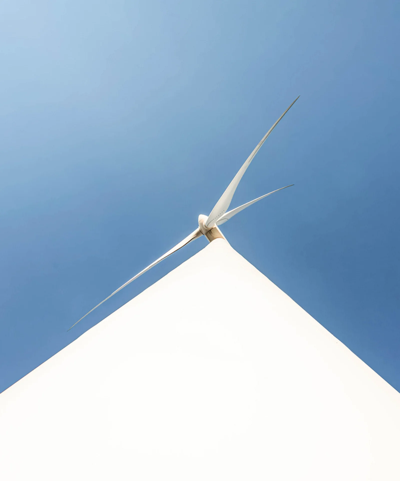 Modern wind turbine against a clear blue sky gft-image-sustainability-03.jpg