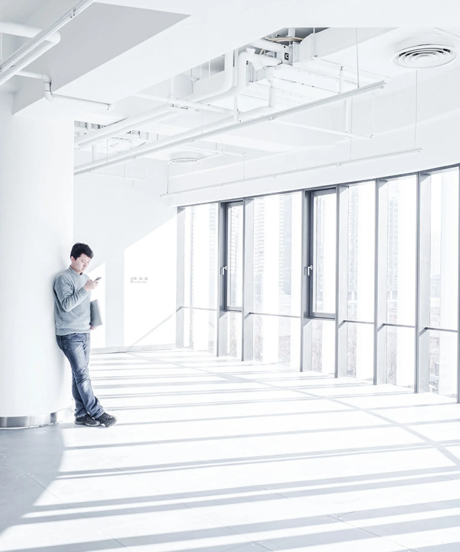 Professional using mobile technology in a modern office space gft-image-mood-23.jpg