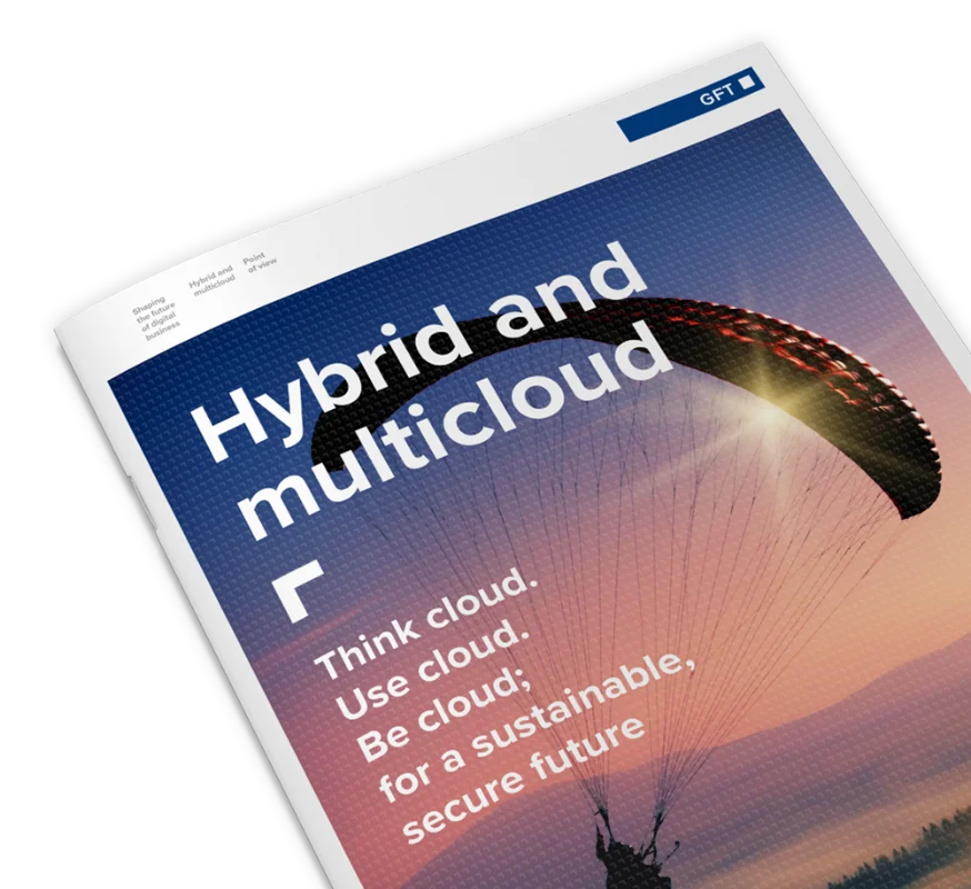 A close-up of a GFT publication titled &quot;Hybrid and Multicloud,&quot; featuring an image of a paraglider against a sunset, symbolising agility and freedom in cloud computing.