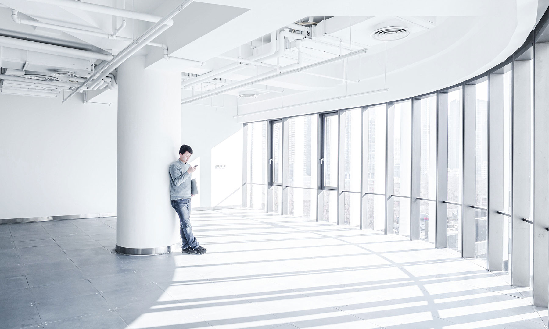 Professional using mobile technology in a modern office space gft-image-mood-23.jpg