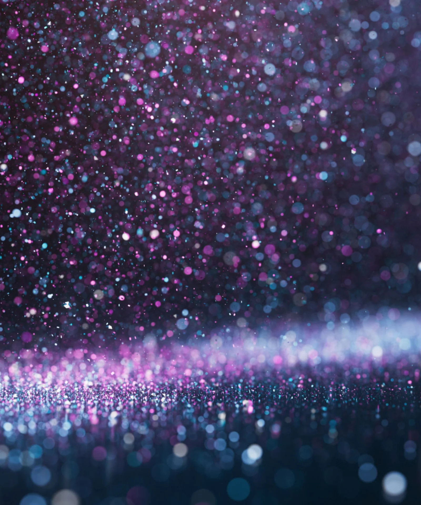 Awards Overview: Celebrating GFT's Achievements Abstract image featuring a glittering background with a mix of purple, blue, and white sparkles, symbolising the celebration of excellence and achievements.